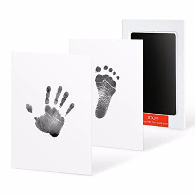 Black handprint and footprint with ink pad