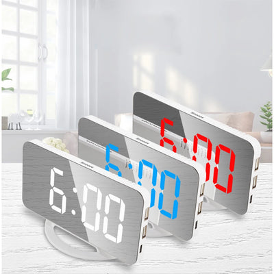 Three digital alarm clocks with different LED colors