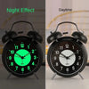 Night and daytime view of retro twin bell alarm clock