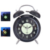 Black retro twin bell alarm clock with luminous dial