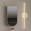 Vertical LED mirror lamp next to modern mirror