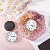 Hexagonal resin clock with pink floral design.