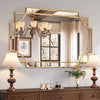 Elegant wall mirror with gold frame above dresser