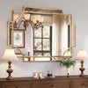 Elegant wall mirror with gold frame above dresser