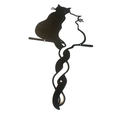 Close-up of black metal cat wall art ornament