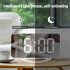 Alarm clock with intelligent light sensor for day and night